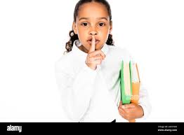 cute african american schoolgirl showing hush gesture while holding books isolated on white Stock Photo - Alamy