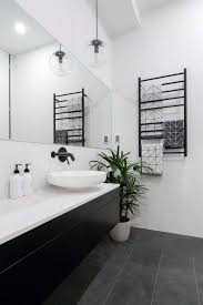 A large mirror and glass shower doors also contribute to this visual trick. The Block 2016 Week 3 Main Bathroom Reveals Minimal Bathrooms White Bathroom Designs Minimal Bathroom