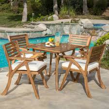 This table is made from teak and perfect outdoor furniture for your garden. Noble House Hermosa Teak Brown Finish 5 Piece Wood Square Outdoor Dining Set With Cream Cushions 8114 The Home Depot