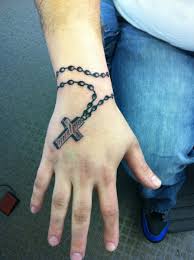 Rosary tattoo that proves simplicity is beauty. 32 Rosary Tattoos On Wrists