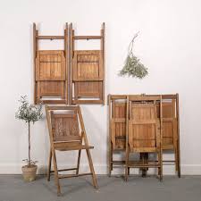 Guests Are Coming Who Needs Extra Seating These Vintage Wood Chairs Are Perfect For Folding Up Or Hanging On Wood Chair Wood Floor Design Wood Folding Chair