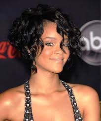 The medium length curly hair of rihanna tossed up in a puff and spread around the face lends a. Curly Hairstyles Short By Rihanna Hairstyles Cool
