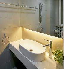 Beautiful Under Cabinet Bathroom Lighting Created By Using Warm White Led Strip Lights Htt Modern Bathroom Lighting Led Tape Lighting Bathroom Lighting Trends