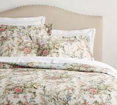Lush blooms unfurl with painterly detail on our bedding, inspired by antique palampore textiles. Marlena Floral Reversible Duvet Cover Shams Pottery Barn