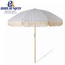 Protection from the sun means extended beach time and with umbrellas as chic as these, you'll wanna chill on the sand all summer long. High Quality Full Printing Custom Beach Umbrella Tassel Wood Pole