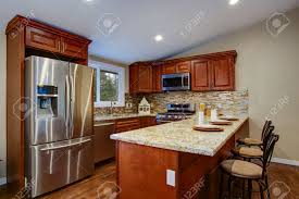 Maybe you would like to learn more about one of these? Brown Kitchen Design With Mahogany Kitchen Cabinets Breakfast Stock Photo Picture And Royalty Free Image Image 95650113