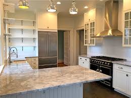 The larger patches to these quartzite countertops make it stand out against the white of the rest of this kitchen. Super White Quartzite Everything You Need To Know