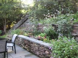 Idea For Steep Back Yard A Steep Hill Was Terraced Into A Gorgeous Triple Decker Garden Comp Backyard Hill Landscaping Terrace Garden Design Sloped Backyard