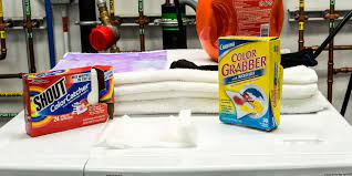 You can get these fabric sheet things that you put in the machine with your washing as it washes that absorb the dye as it runs in the water. A Color Catcher Claims To Absorb Dye In The Wash We Tested To See If It Worked Reviewed