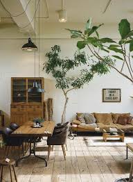 Modern Loft Living Room With A White Beige Tan And Brown Color Scheme Featuring Large Trees In Farm House Living Room Industrial Home Design House Interior