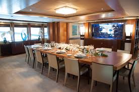 To the great delight of both children and adults, a diver makes feedings twice a day in full view of the dining room. Mys Anastasia Dining Table In The Main Saloon Dining Are With A Huge Aquarium Yacht Charter Superyacht News