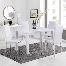 Curved high gloss white pedestal with steel detailing. Goldfan High Gloss Dining Table And Chairs Set 4 People Pu Leather Seats Morden Kitchen Table Dining Room Set White Buy Online In Faroe Islands At Faroe Desertcart Com Productid 117706699