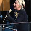 The singer reportedly wore a schiaparelli couture dress with a gold dove brooch, which people thought was very hunger games. 1