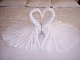 Now, fold out the bottom of the swan, and set it where you'd like to display it. Pin By Renee Griffiths On Diy How To Fold Towels Towel Swan Fun Towels