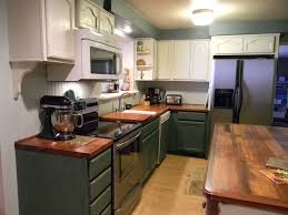Two Tone Kitchen Cabinets In Small Kitchen The Wood Counter And Stainless Appliance Cause An Green Kitchen Cabinets Country Kitchen Cabinets Kitchen Cabinets