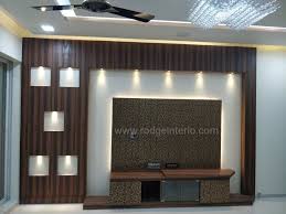 Tv Unit Designed For 2bhk Use Of Charcoal Sheet Paneling Drop Lights Tv Console Cabinet Visit Ww Tv Unit Design Wall Tv Unit Design Tv Unit Interior Design
