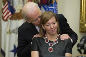 Ex-Defense secretary's wife says photo of her with Biden ...