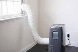 Two colleagues can be seen also installing units in the background. How Do Portable Air Conditioners Work Ac Parts Cooling Principles