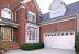 Red Brick House With Stained Garage Door