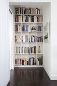 We just built this wall to wall bookshelf in our new house! Outstanding Apartment Attracting Bookshelf Design Ideas In Bedroom With White Wooden Built Wall Bookshelf Design Wall Bookshelves Floor To Ceiling Bookshelves