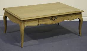 Images are for illustrative purposes only & may be slightly different when ordered. A Modern Laura Ashley Avignon Oak Coffee Table The Rectangular Top Above Two Frieze Dra