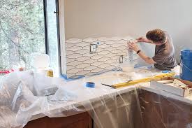 Whether you're remodeling the and as you look, it's important to think through all the things a backsplash is and does—from how it matches the color scheme to how it gets on the wall. 7 Diy Tricks For Installing Your Own Kitchen Backsplash Tile