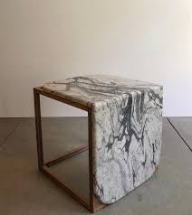Even though the two may occupy exactly the same footprint, the wood table will have a bigger presence in the room and seem to take up more floor space. Side Table Kub Marble Wood By Atelier Bussiere Pepinshop