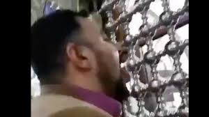 Iran coronavirus Video People lick, kiss walls of holy shrine to ...