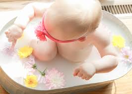 Pour enough breastmilk into the water to make the water cloudy. Breast Milk Bath Blog Tracy Marie Photography