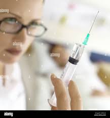 Nurse preparing drugs hi-res stock photography and images