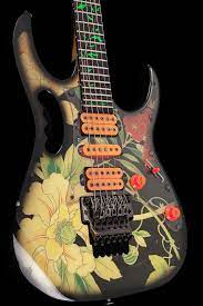 The jem77 features a special floral pattern finish which is printed on cloth and glued to the body. 1989 Ibanez Jem 77 Floral Pattern Bigfoot Guitars