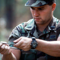 US Army (USA) Specialists (SPC) Lacy Arnold (left), is briefed by USA  Sergeant (SGT) Edward Tekamp, as they prepare to execute ongoing operations  for Company A, 700th Support Battalion, Oklahoma Army National