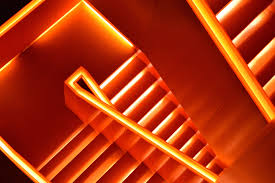 Great Use Of Tape Light For Rail And Under Stair Lighting At The Zollverein Coal Mine Industrial Complex In Es Orange Wallpaper Orange Aesthetic Neon Wallpaper