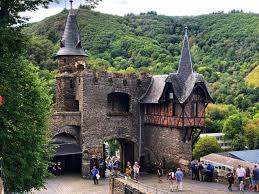 Cochem castle towers over a medieval town on the mosel river. Reichsburg Cochem Is One Of The Most Admired Castles European Cuisine Culture Travel C