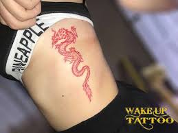 Smaller image of dragon emerging from somewhere in your body can work as good as the whole on the other hand, it's really cute and feminine to go for red, associated with flames and fire and combine. Dragon Tattoos Red Ink Tattoos Gallery