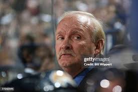 Bill Wellman,representative from the Hockey Hall of Fame, carries the...  News Photo