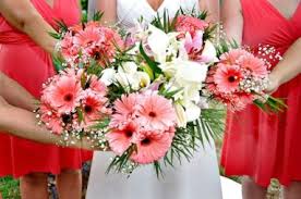 Gerbera daisies come in a rainbow of colors and are cherished for their long wavy stems and big, bold blooms. Floral Design Services Sun Sea Beach Weddings