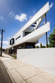 Because buildings on triangular lots tend to include dead space in the acutely angled corners, the three corners in this house are used as exterior voids, said the architects. Moving Company Quotes Tips To Plan Your Move Mymove Triangle House Architecture House Architecture