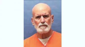 Woman decorates ceiling with 1,700 Christmas baubles