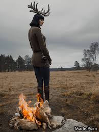 Porn image of 20 fully clothed flowers orange deer horns sweater night  created by AI