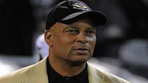 Ronnie Lott falls off television studio set