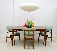 Nelson Ish Lamp Hovering Over A Danish Modern Dining S Dining Room Furniture Modern Mid Century Modern Dining Room Furniture Mid Century Modern Dining Room