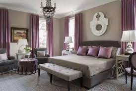 Primary bedroom featuring a white bed surrounded by white and purple walls along with a wooden ceiling with exposed beams and a skylight. Amethyst Purple Luxury Velvet Curtains Custom Bedroom Curtain Panels Rod Pocket Window Drapery Purple Master Bedroom Feature Wall Bedroom Taupe Bedroom
