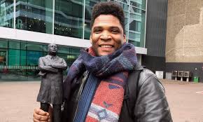 Quinsy gario is an activist in the movement against zwarte piet, as well as a performance artist. Quinsy Gario Monument For Martin Luther King