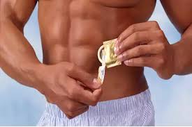 Image result for images of a man  cutting condoms with scissors