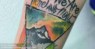 After college justin became an art teacher to inner city students who would eventually become the inspiration for the raw canvas, justin's tattoo studio. Watercolor Style Mountain Tattoo Inside A Triangle And