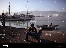 Wideline Joseph 19, looks at the camera as she sits at the port of  Port-au-Prince, Haiti, Tuesday, March 22, 2011. (AP Photo/Alexandre  Meneghini Stock Photo