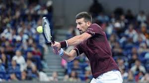 Djokovic wins first match since Wimbledon in China - BBC
