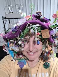 EDIT: We have attached the official weight video below in the comments. The  hat with trinkets weighs 1.315 kg. The winner of the raw opal chunk is De Anna  Sellers with a