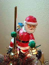 Mr Christmas Lighted And Animated Santa Tree Topper Ib 42559314 It will bring a festive and cheerful santa claus sits atop your tree and wraps his long arms around it in a festive hug.